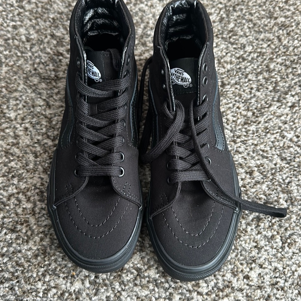 Brand new size 5.5 women’s all black high top vans. Never been worn.